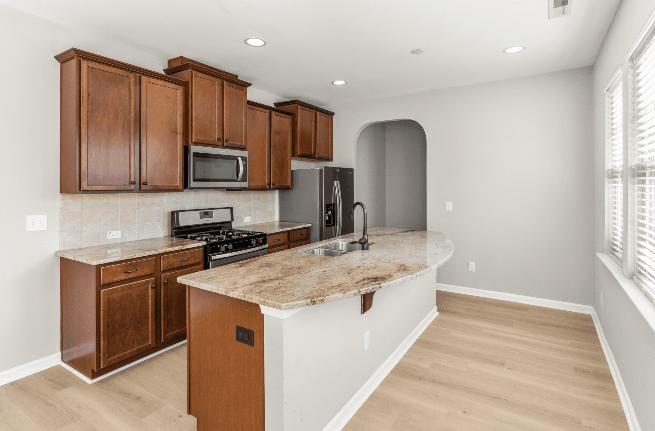 Warm kitchen with brown cabinets